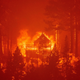 Flames consume multiple homes as the Caldor Fire pushes into the Echo Summit area near Lake Tahoe on Aug. 30, 2021.